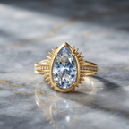 Gold Pear-Cut Aquamarine Sunburst Halo Ring